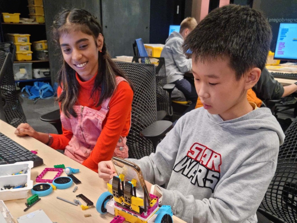 boy and girl building a LEGO robot